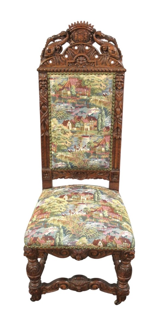 Antique highly carved fish & northwind faces oak chair: Antique highly carved with fish and Northwind faces oak upholstered chair, structurally sound and good condition for age, tapestry style upholstery in good condition. 52"h x21"w x 19"d seat height 20"