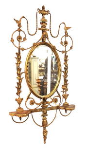 Antique French carved and ornate wood and gesso mirror: Antique French carved and ornate mirror in wood and gesso with candle sticks and shelves, structurally sound, shows repairs and gesso loss, see photos. 56"h x 29"w x shelves 6"d