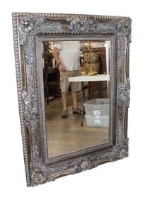 Highly carved beveled shell carved decorator mirror