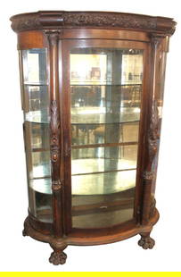 Antique Oak Curve Glass Lion Head China Cabinet: Impressive antique quartersawn oak curved glass lion head and paw foot china cabinet attributed to Horner Furniture, mirror back, 2 glass shelves, 1 mirror glass shelf, right side is curved plexiglass