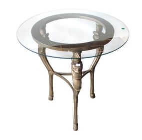 Iron & glass top round table w/griffin heads and hoof ft.
