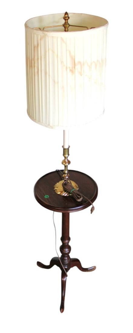 Candle stick lamp table with shade: Candle stick lamp table with shade, mahogany finish, structurally sound with finish loss on feet and staining on shade. 55"h x 16" diameter