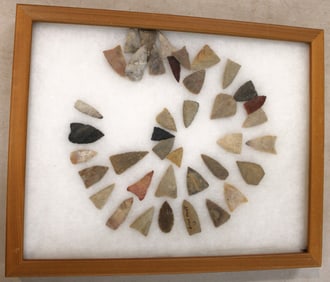 Native American artifacts arrow heads in pine case