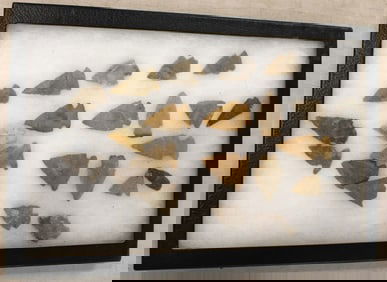 Native American artifacts arrow heads in case