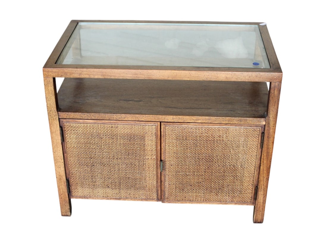 Mid century modern walnut glass top nightstand believe Jack Cartwright: Mid century modern walnut glass top 2 door nightstand with woven wicker front doors believe Jack Cartwright, structurally sound, original finish with wear on top, glass is good, 21"h x 26"w x 16"d