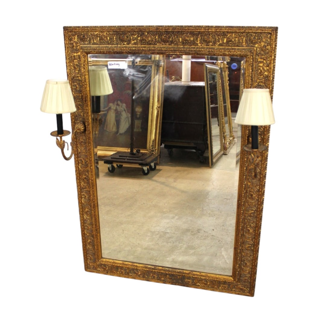 Awesome semi antique mirror with working wall sconces: Awesome semi antique beveled carved mirror with lighted working wall sconces in antique gold finish, structurally sound and original finish and good condition. 44"h x 32"w x (with sconces) 12"d