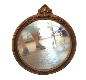 Semi antique round hanging mirror with carved top