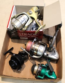 4 vtg fishing reels and accessories: South Bend, (2) oKuma, Mitchell