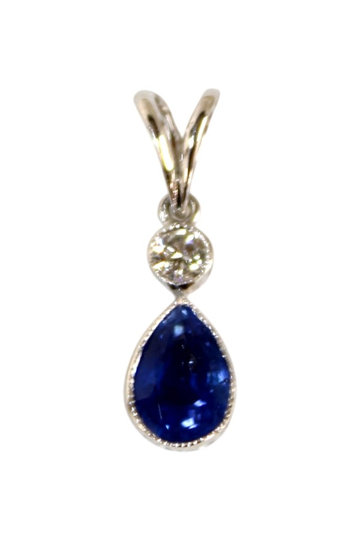 18k white gold 1.10ct sapphire and diamond pendant: Delicate 18k white gold and 1.10ct sapphire and diamond pendant