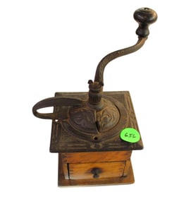 Antique cast iron coffee grinder on wood base