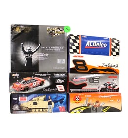 7 Die Cast 1/24 scale cars in boxes, mixed.