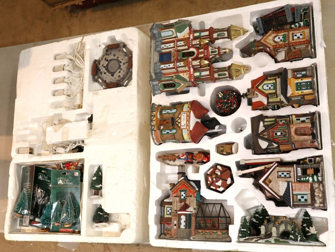 Large lighted Christmas porcelain village with extras: Large lighted Christmas porcelain village with extras in box. Box 27.5 x 19.5" x 8"