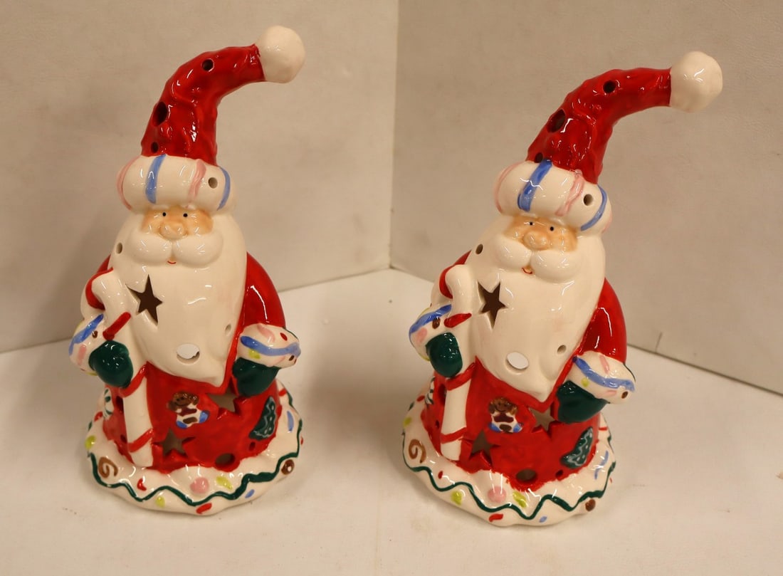 2 porcelain Santa candle holders: 2 porcelain Santa candle holders. Approx. 9.5"h x 5" diameter