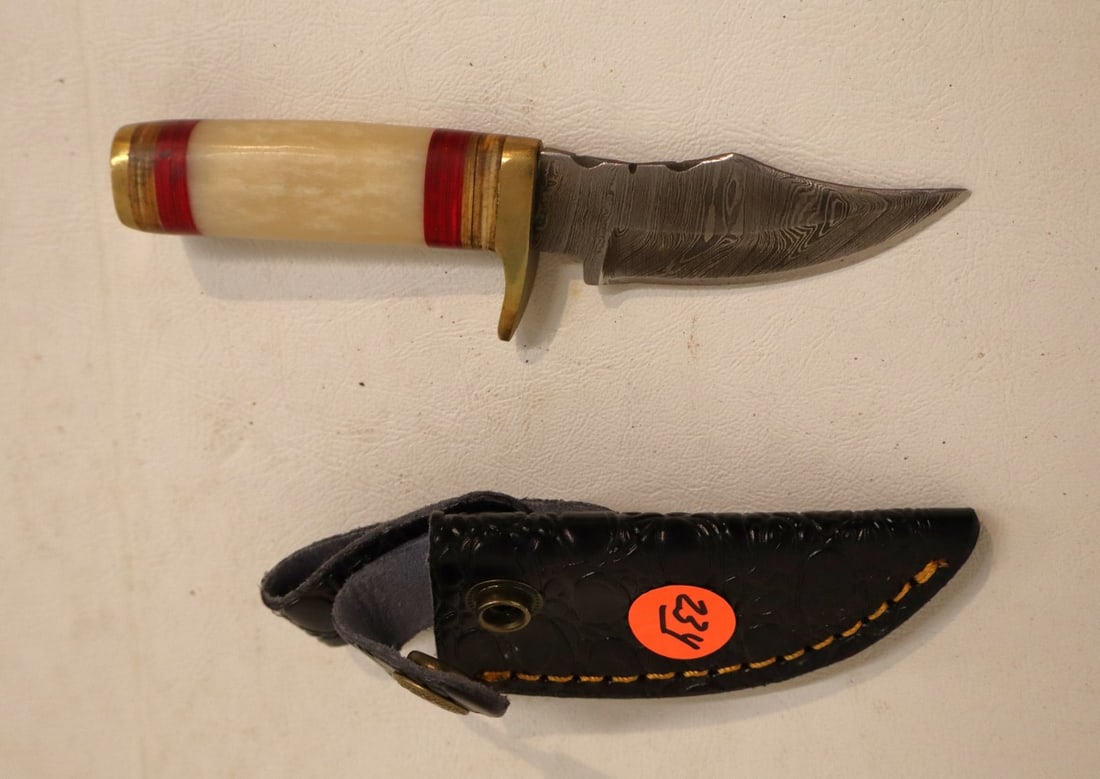 Damascus knife with bone style handle and leather sheath: Handcrafted knife with leather sheath damascus blade with bone style handle and belt loop with leather sheath. 7"l