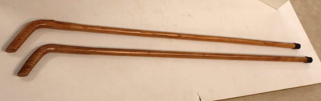 2 hand crafted walking canes in natural finish woods 35"l: 2 Hand crafted walking canes in natural finish woods. 35"l