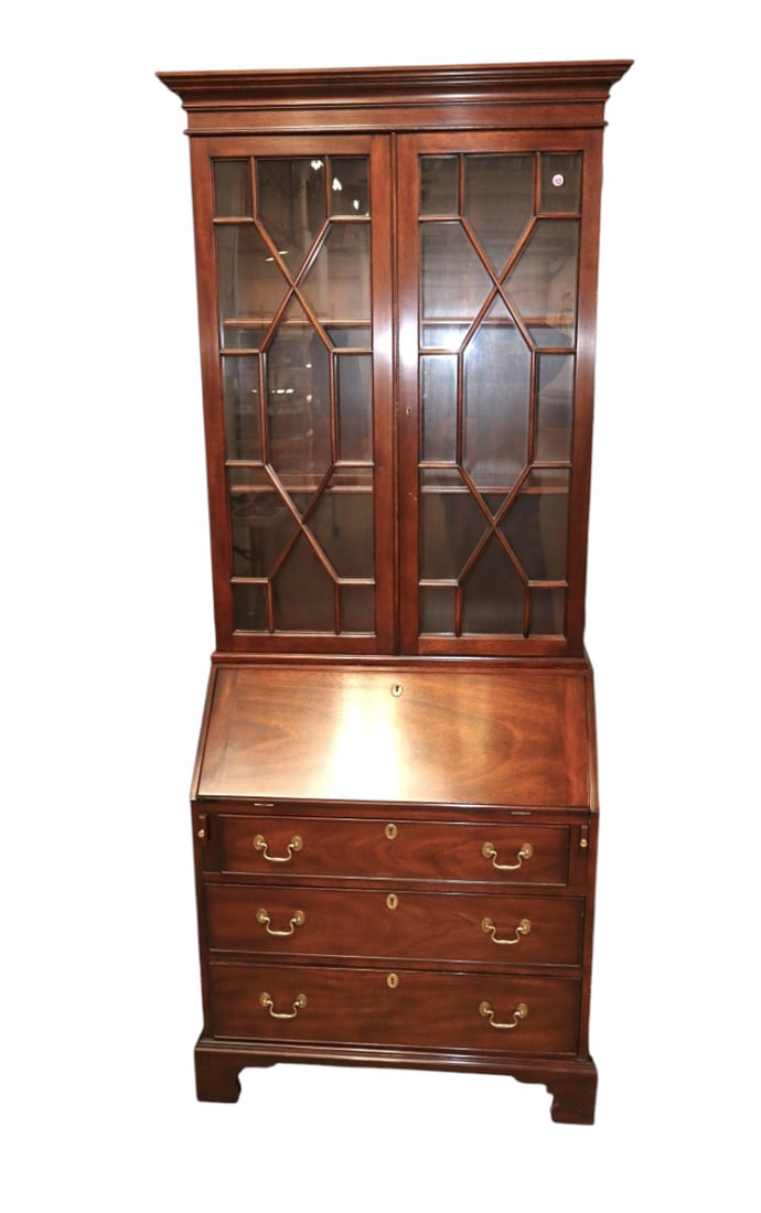 Henkel Harris 2 piece solid mahogany petite secretary bookcase with keys original finish: Henkel Harris 2 piece solid mahogany petite secretary bookcase with 2 wood fixed shelves, individual pane glass, keys, original finish structurally sound and in good condition. Footprint 81.5"h x 34.5