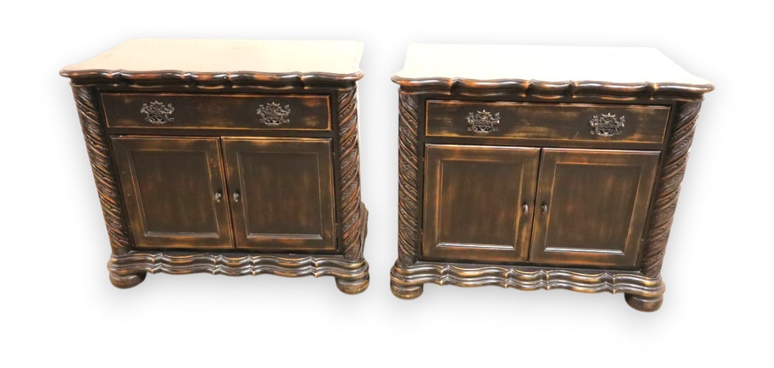 Pair Ethan Allen style over-size nightstands with leaf carved columns and scallop top: Pair of Ethan Allen style over-size nightstands with leaf carved columns scallop top in distressed antique black finish 1 drawer 2 door structurally sound and in good condition. Each 30.5"h x 35.5"w x