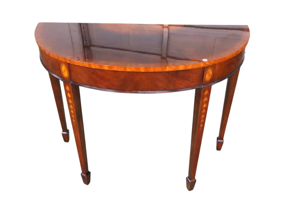 Quality sunburst and flower inlaid console table: Quality burl mahogany sunburst and bell flower inlaid demilune spade foot console table nice shiny original finish structurally sound and in good condition. 32.5"h x 42"w x 18"d