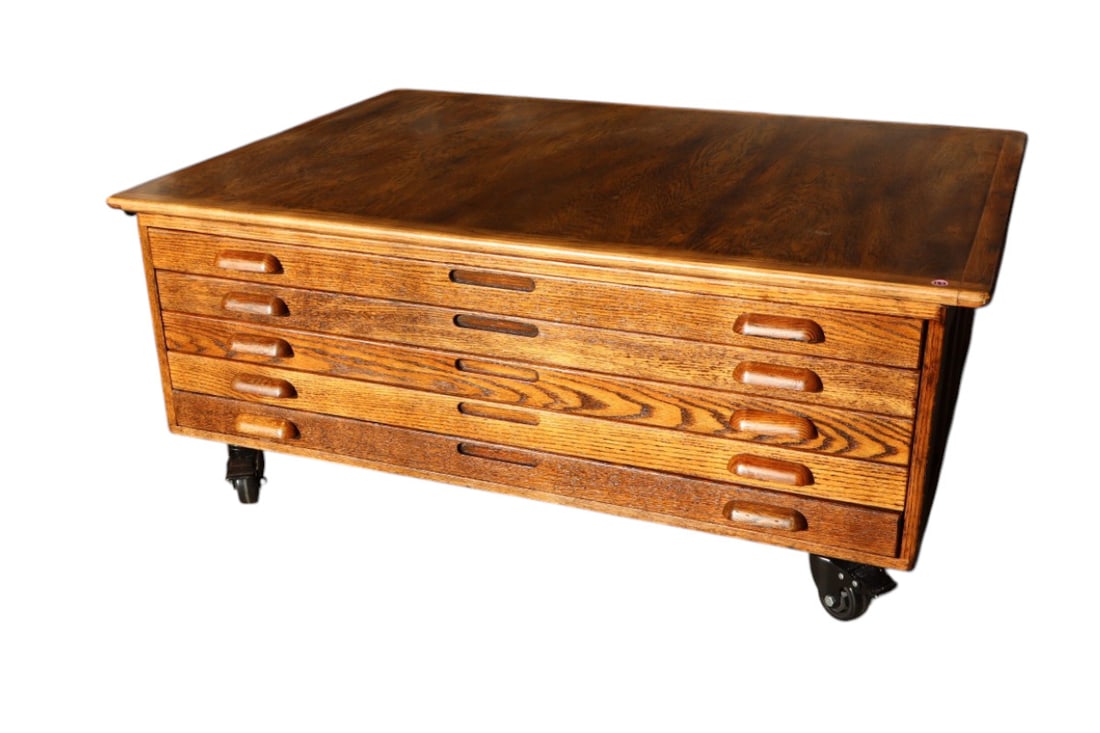 Industrial oak map cabinet coffee table on wheels: Industrial 5 drawer oak map cabinet coffee table on wheels, custom made, nice finish structurally sound and in good condition. 19.5"h x 48"w 36"d