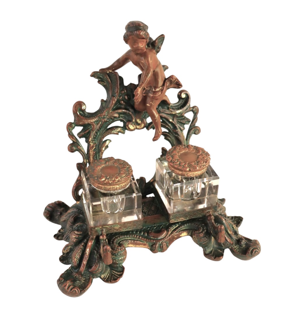 Bronze cherub crystal ink well pen holder: Semi antique bronze cherub crystal ink well pen holder in colored bronze finish, one ink well has chip see photos. 6"h x 6"l x 4"d