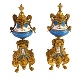 Pair of antique dore bronze and porcelain lidded urns