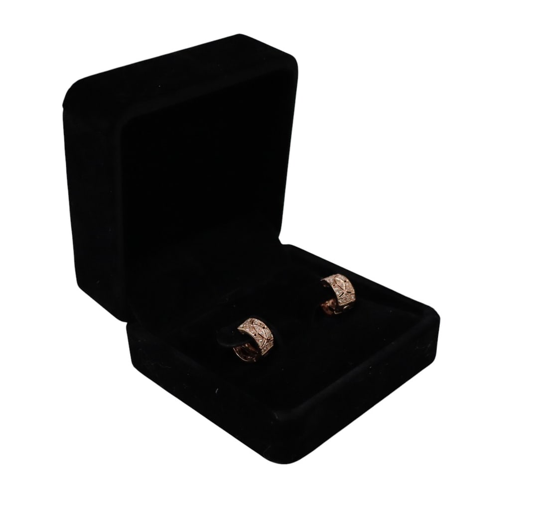 Diamond 14kt rose gold huggie earrings over sterling: Diamond and 14kt rose gold over sterling huggie earrings in gift box. Approx. 1/2 diameter