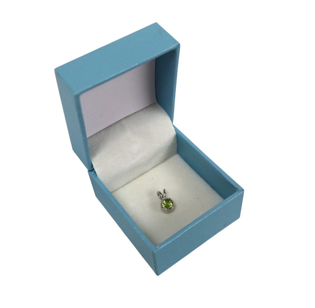 Peridot .53ct pendant in sterling silver: Peridot .53ct pendant in sterling silver with gift box. Approx. size almost 1/2"