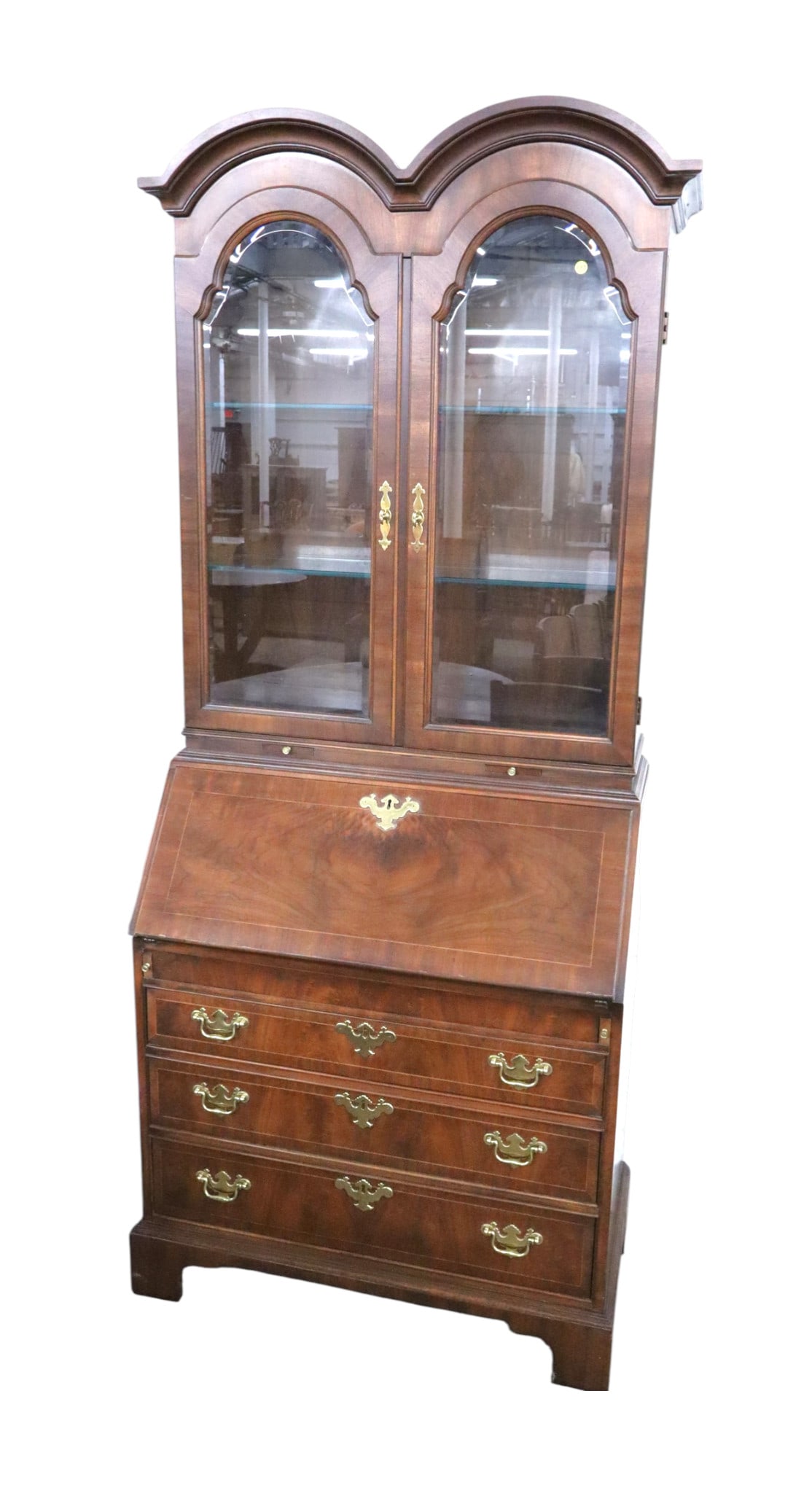Nice VTG Weiman 2pc double arch top secretary curio: Nice vintage Weiman Furniture burl mahogany and inlaid 2 piece double arch top secretary lighted curio with 2 adjustable glass shelves, original finish, structurally sound and in good condition. 85"h