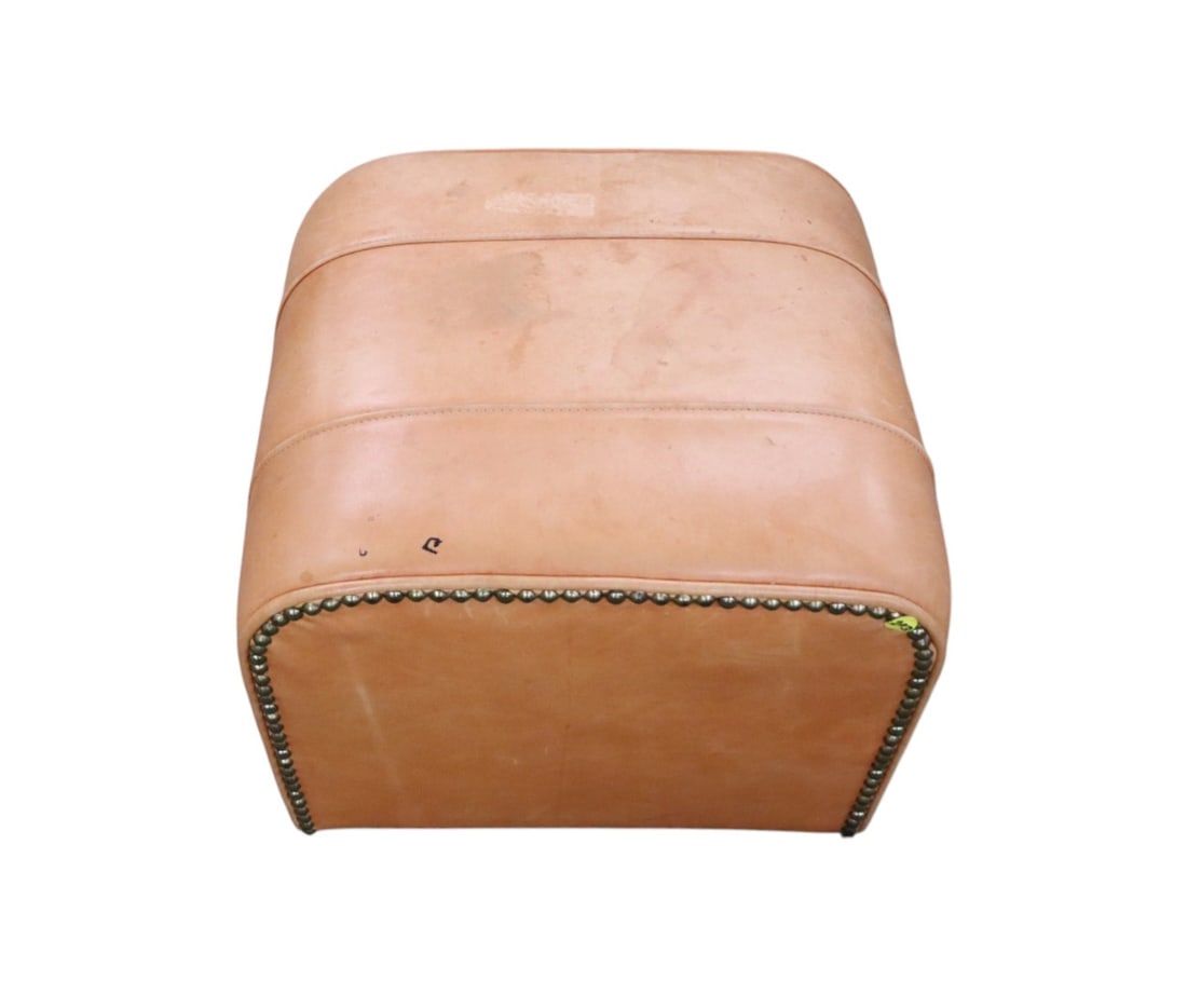 Vintage Ralph Lauren leather ottoman with tacking: Vintage Ralph Lauren leather ottoman with decorative tacking, structurally, no rips or tears needs cleaning. 14"h x 18"w x 16"d
