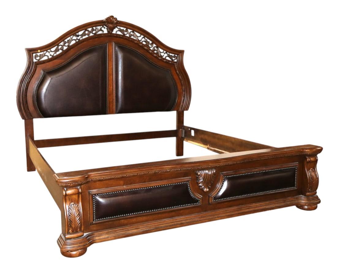 Impressive contemporary leather king size bed: Impressive contemporary king size carved bed with leather accents and comfort low footboard in the antique distressed walnut finish by American Signature Furniture, original finish, structurally sound