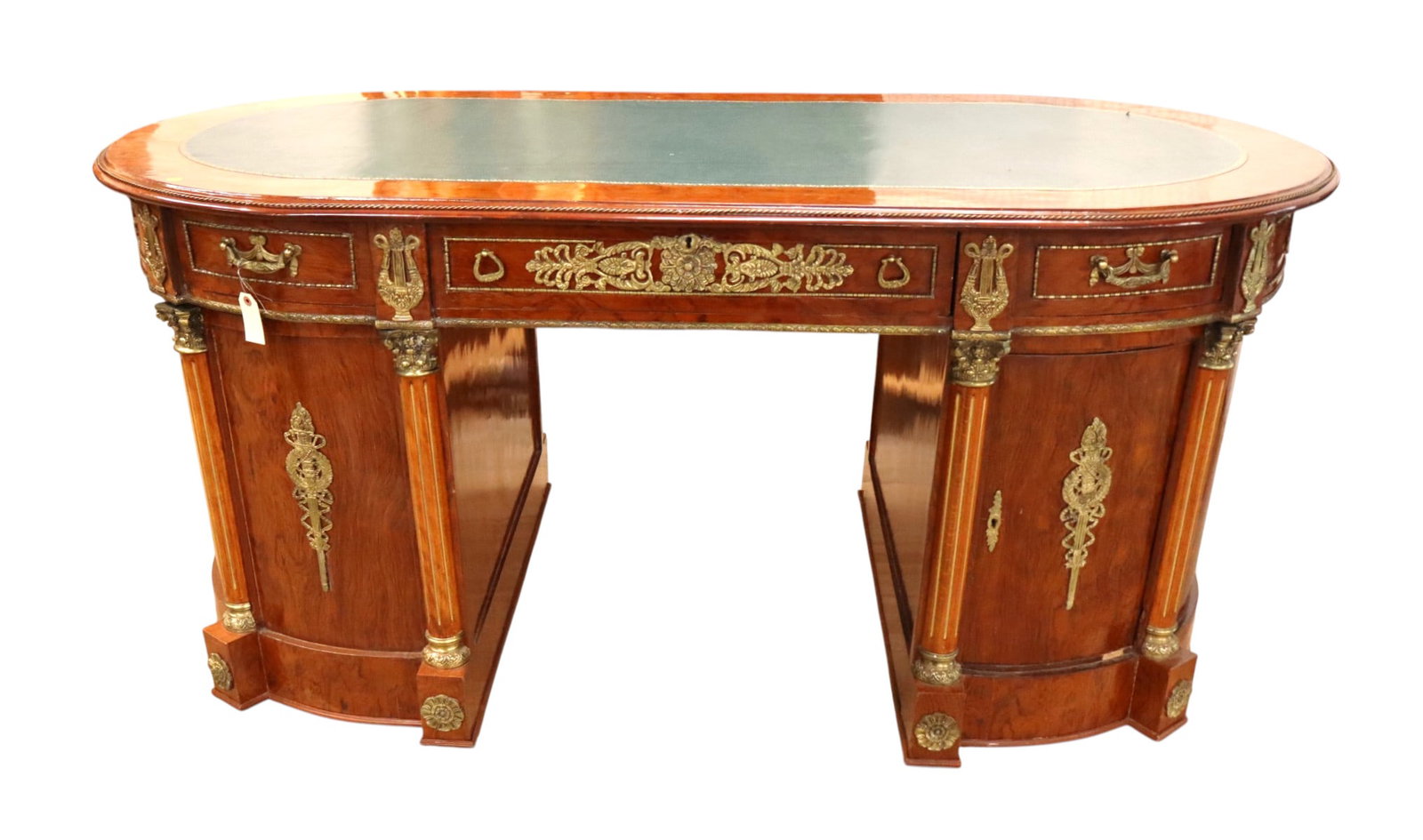 French 3 part bronze & leather oval desk: French style 3 part leather top burl walnut oval desk with heavily applied bronze decoration, original finish, structurally sound and in good condition with slight wear. 32.5"h x 71"l x 36"d