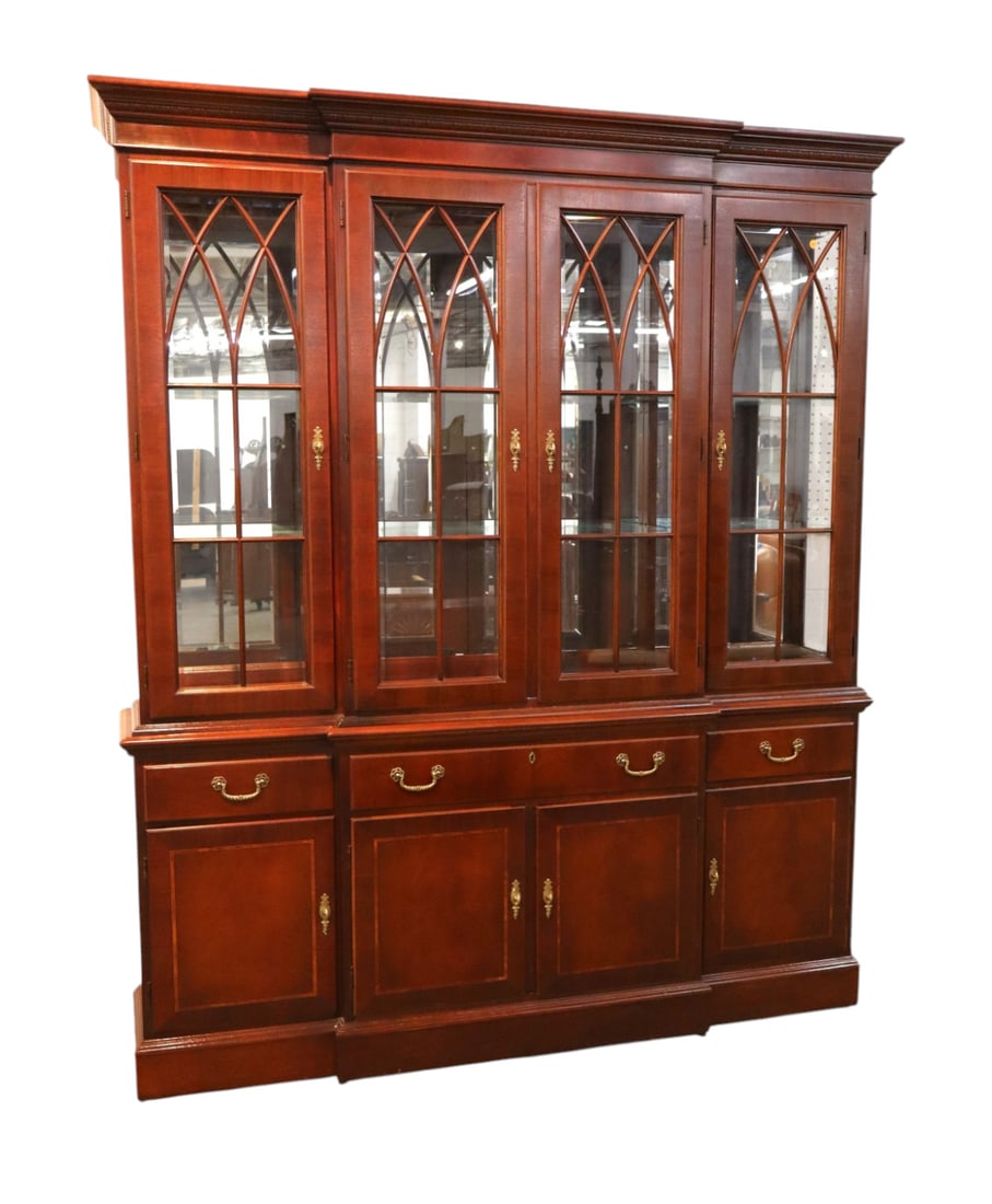 Nice Ethan Allen beveled glass pane china cabinet: Nice Ethan Allen 2 piece 8 door 3 drawer china cabinet with beveled glass panes, lighted interior and adjustable glass shelves, original finish, structurally sound and in good condition. Footprint: 83
