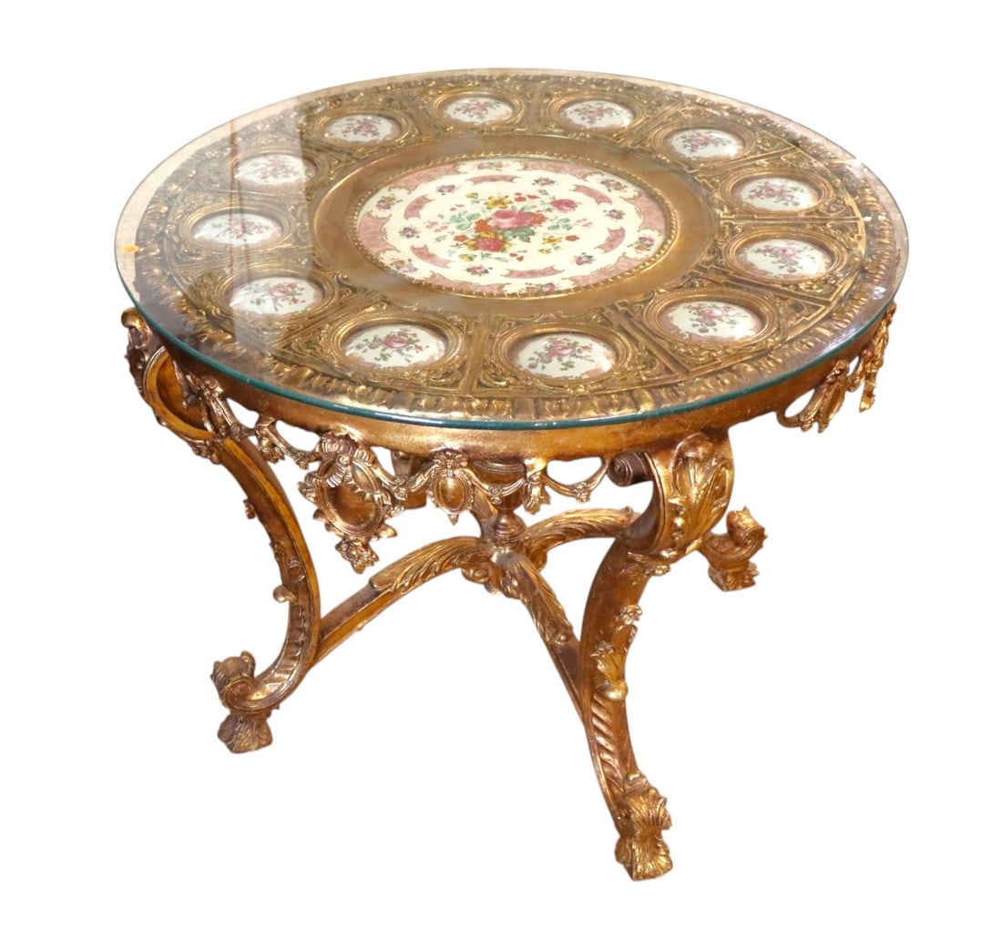 Beautiful ant. Style gold gilt center table manner Sevres: Beautiful antique style gold gilt round glass top center table with porcelain style inserts in the manner of sevres all original, structurally sound and in good condition. 31"h x 37.5" diameter