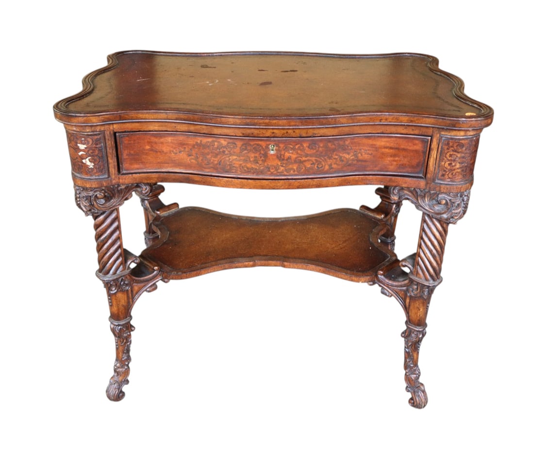 Fancy carved leather top inlaid table manner Theodore Alexander: Fancy carved leather top with inlaid accents in the manner of Theodore Alexander table with 1 drawer, table needs tlc surface wear and missing some inlay, structurally sound in original finish. 29"h x
