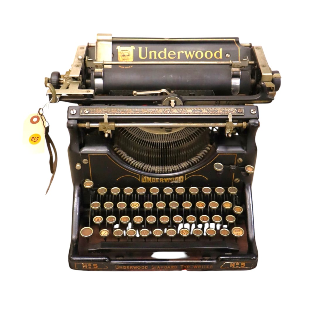 Antique Underwood typewriter on wood. (1 of 9)