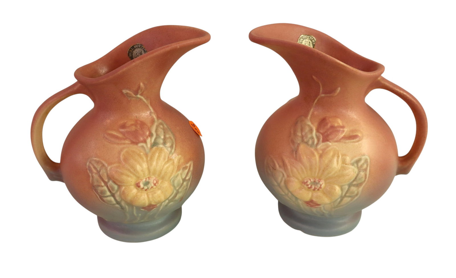 2 Hall art pottery pitchers: 2 Hall art pottery pitchers, no noticeable issues. 7"h x 6.5"w with handle x 6" diameter