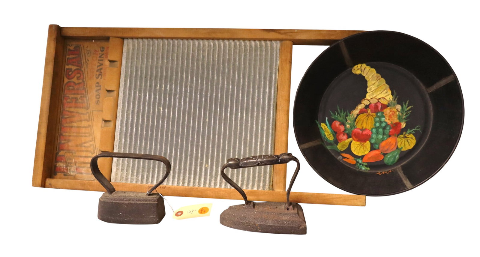 4 antique primitives: Univ washboard, 2 CI hand irons, 1966 dated hand painted tin bowl (1 of 5)