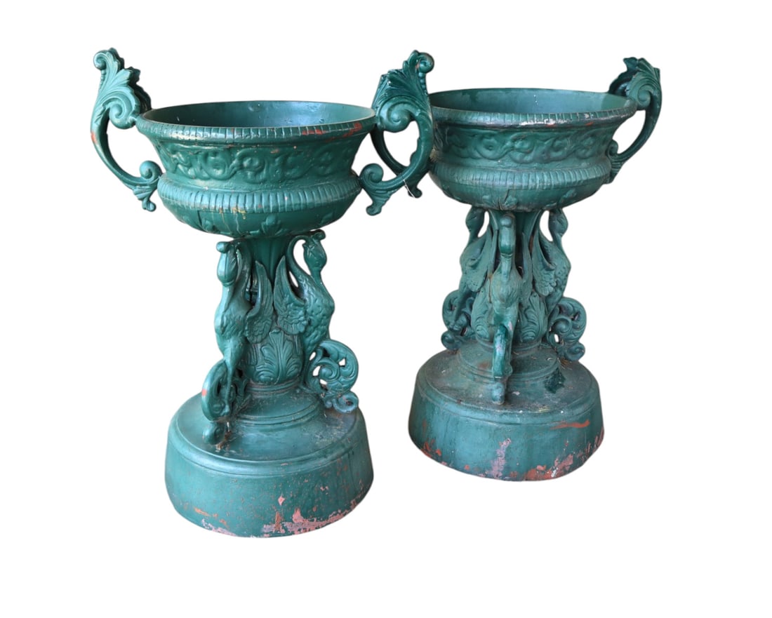 Vtg match pr. cast alum. swan based garden urns: Vintage match pair of cast aluminum swan based double handled garden urns, structurally sound, one is missing part of handle, been painted over the years. Ea. 40"h x 29"w with handles, planter 20" dia