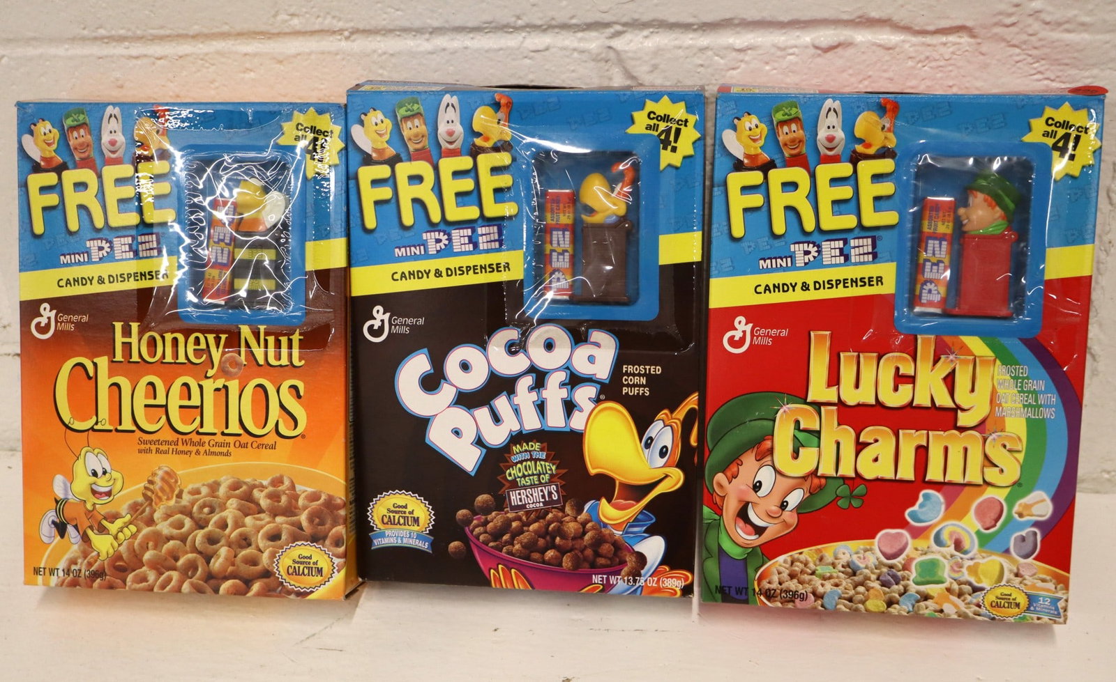 Vintage 3 Cereal boxes with collectible PEZ: Lucky Charms, Cocoa Puffs & Honey Nut Cheerios (pea is (1 of 2)