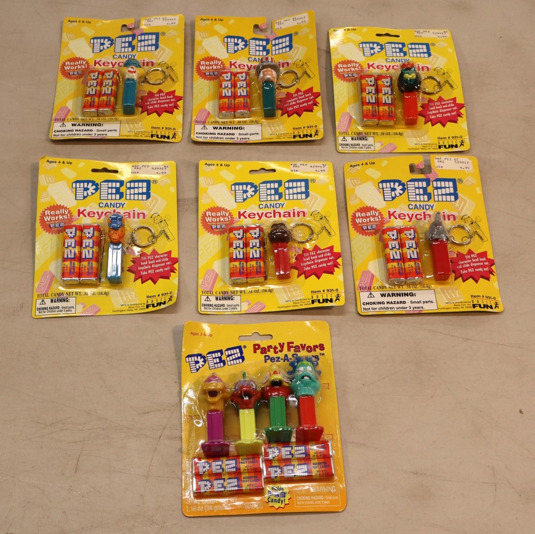 7 vintage PEZ: 6 Candy Key Chains & 1 Pez-A-Saurs Party Favor - factory sealed (1 of 2)