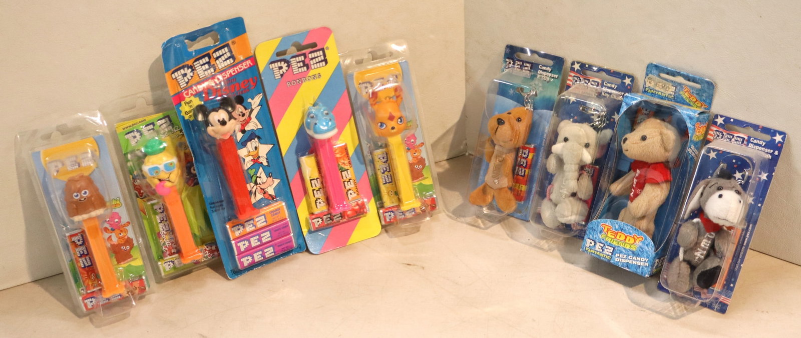 9 vintage PEZ candy dispensers including key chains and others - factory sealed (1 of 2)
