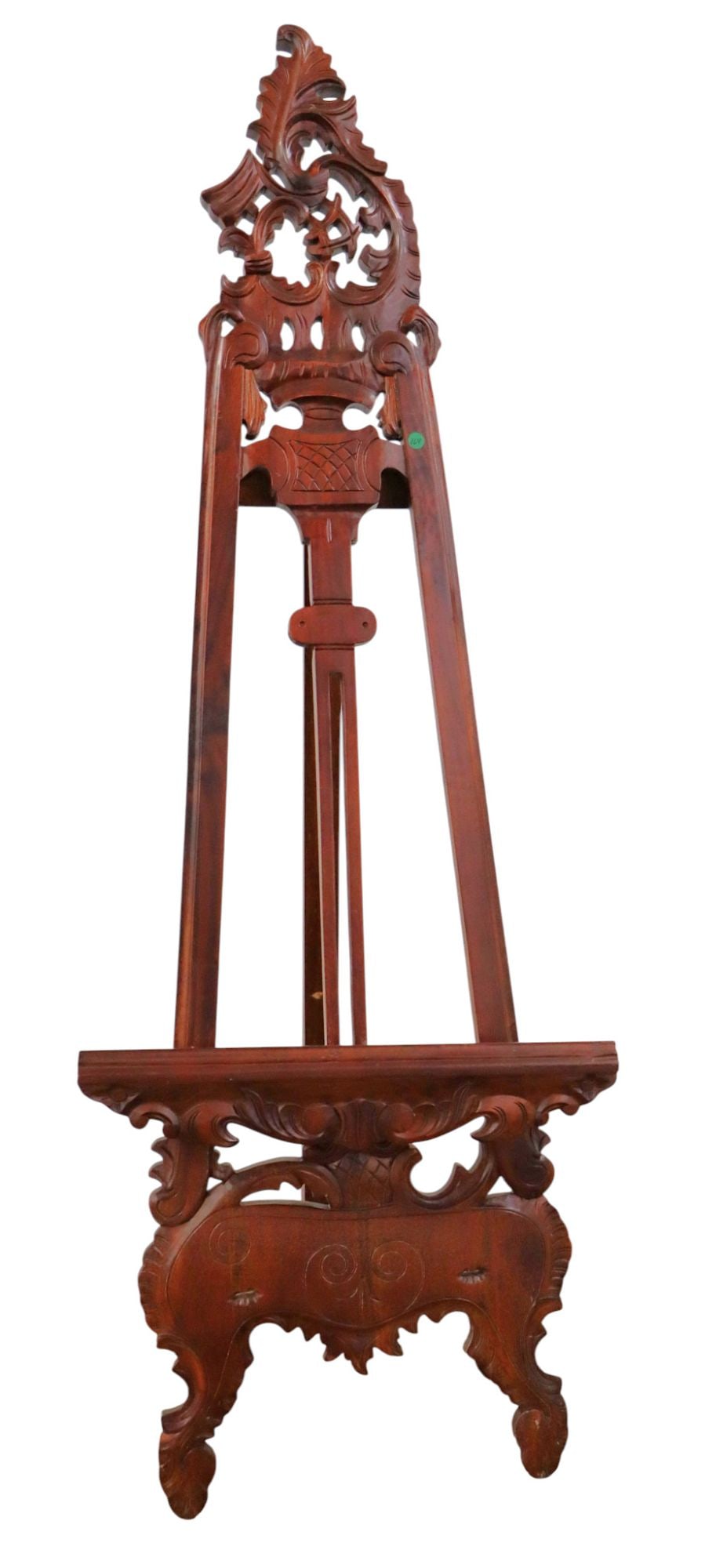 Hand carved solid mahogany adjustable easel: Hand carved solid mahogany adjustable easel with custom made extra finger, original finish, structurally sound and in good condition. 65"h x 24"w x adjustable depth