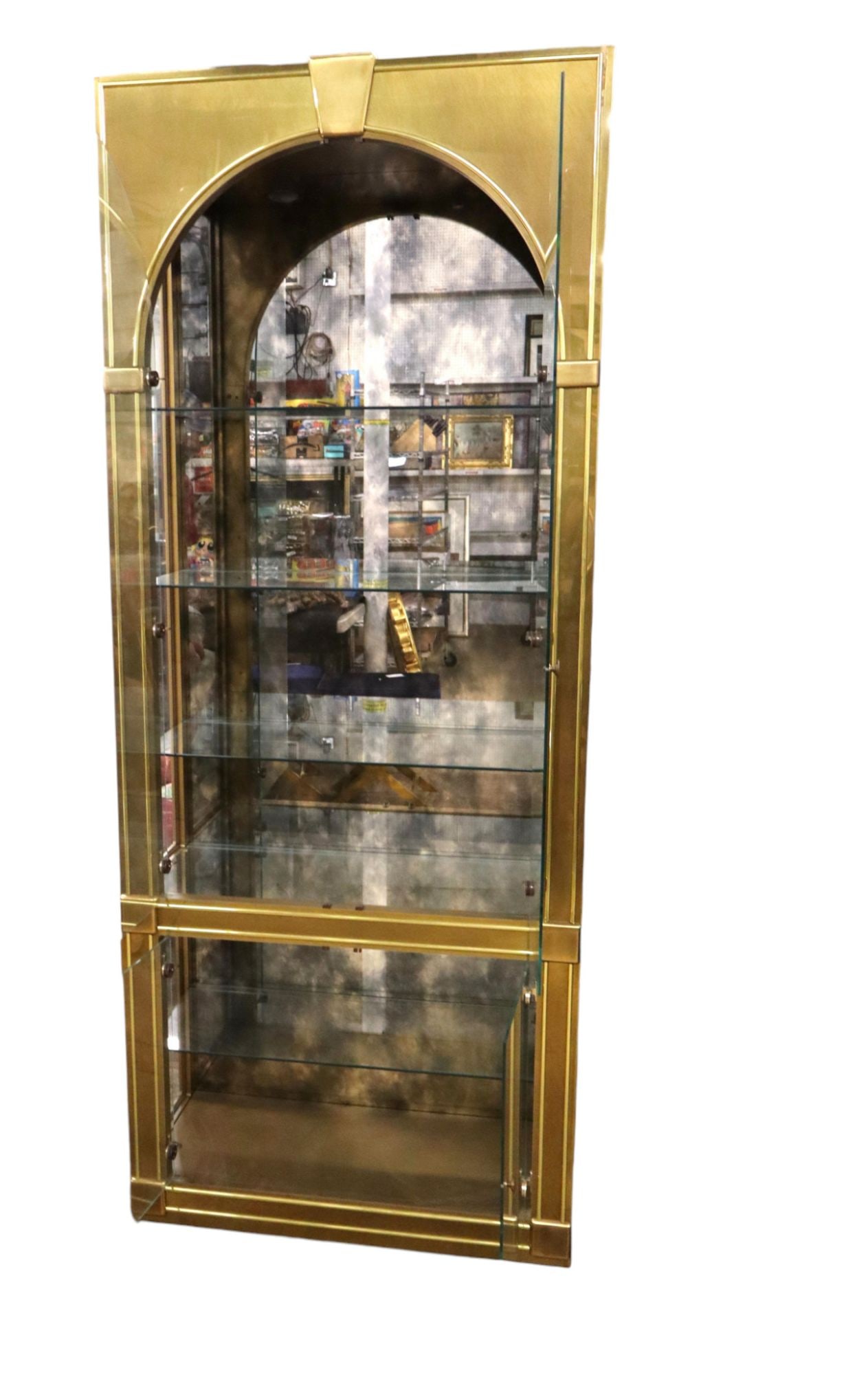 MCM Mastercraft brass, glass, lighted display cabinet: Mid Century Modern Mastercraft Furniture brass and glass 4 door lighted display cabinet with 4 adjustable original glass shelves, brass finish looks good, structurally sound and in good condition. Mat