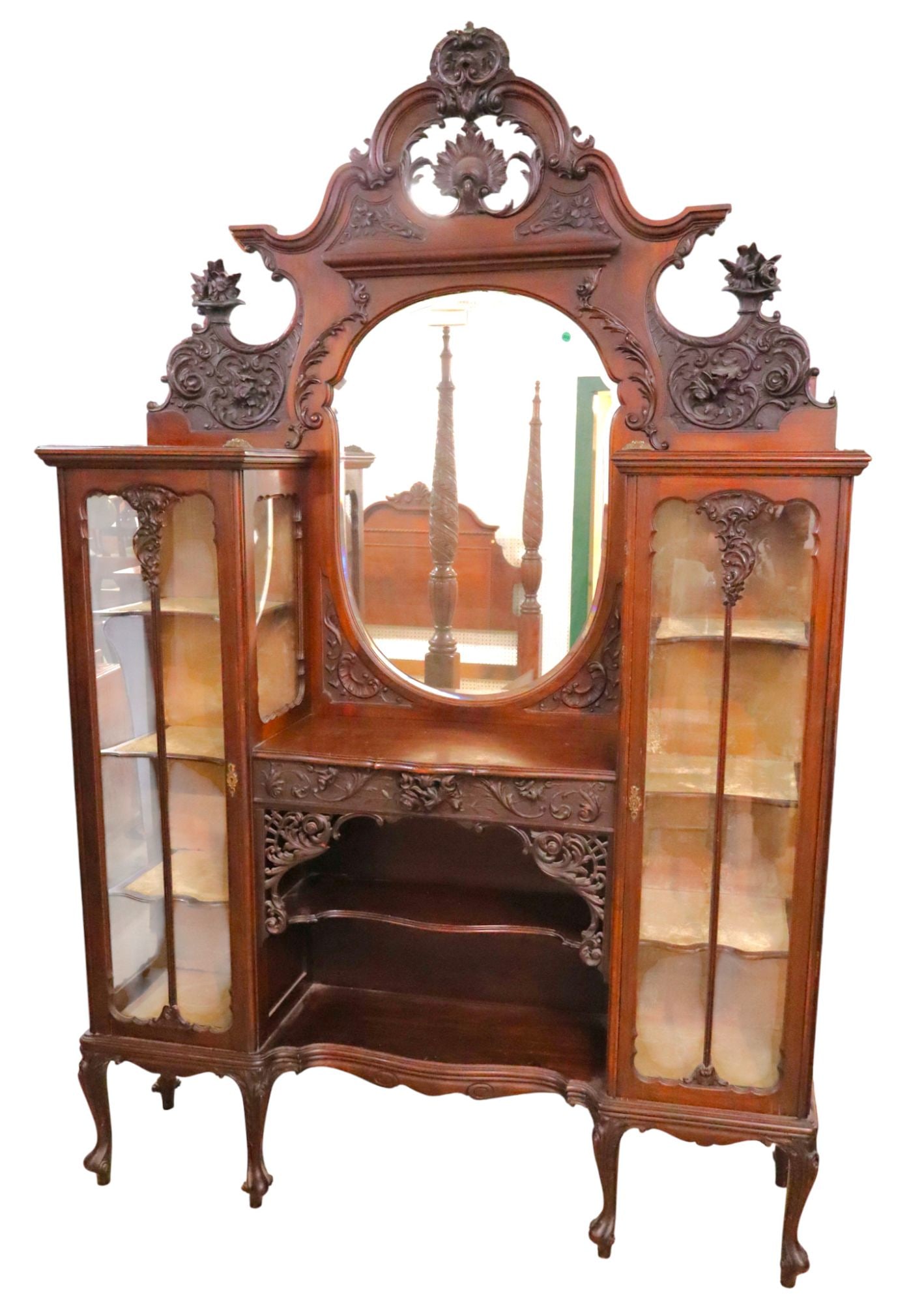 Fantastic antique Victorian etagere curio cabinet: Fantastic antique highly carved and ornate Victorian etagere curio cabinet, hand carved in the mahogany, original beveled glass mirror, mirror back is detachable for transit, original felt, original f