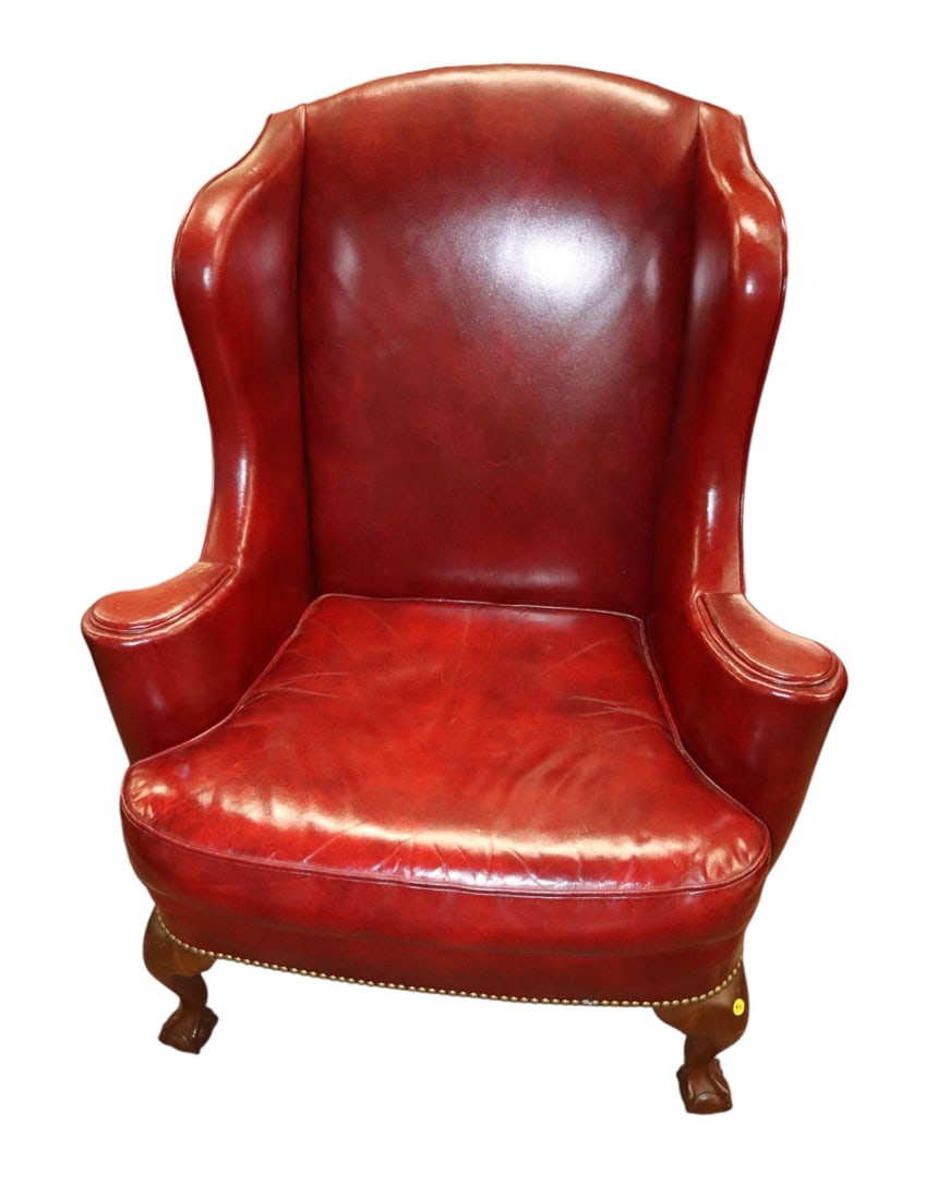 Quality burgundy leather ball & claw wing chair: Quality semi antique leather ball & claw foot wing chair in burgundy leather structurally sound and in good condition for age. 44"h x 35"w x 26"d seat height 19"