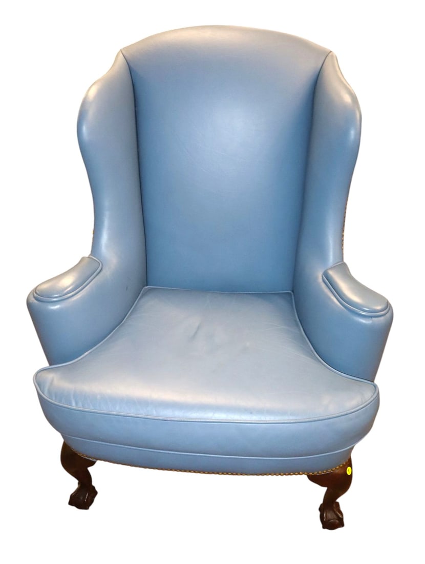 Quality blue leather ball & claw wing chair: Quality semi antique leather ball & claw foot wing chair in blue leather structurally sound and in good condition for age. 44"h x 34"w x 27"d seat height 21"