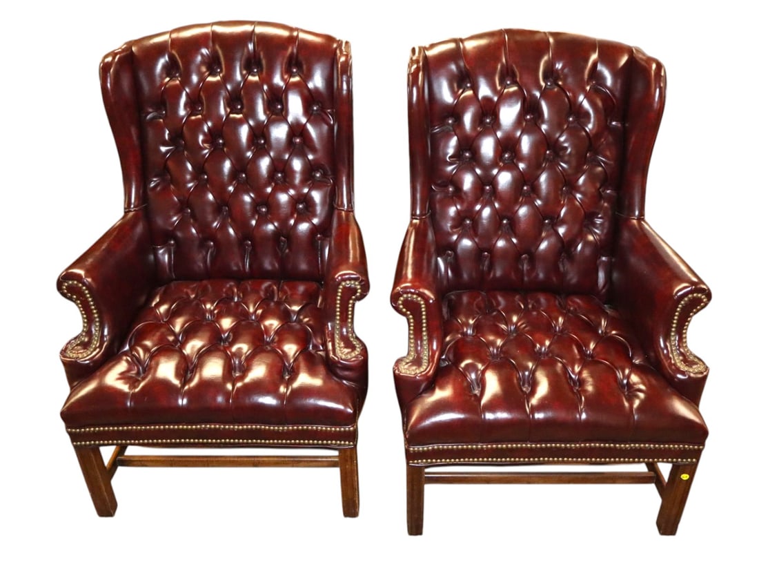 Beautiful VTG PR Chipp style burgundy wing chairs: Beautiful vintage pair of Chippendale style button tuft wing chairs in the manner of Chesterfield, burgundy like leather with mahogany frames, structurally sound. Fantastic rich look. Ea. 43"h x 31"w 