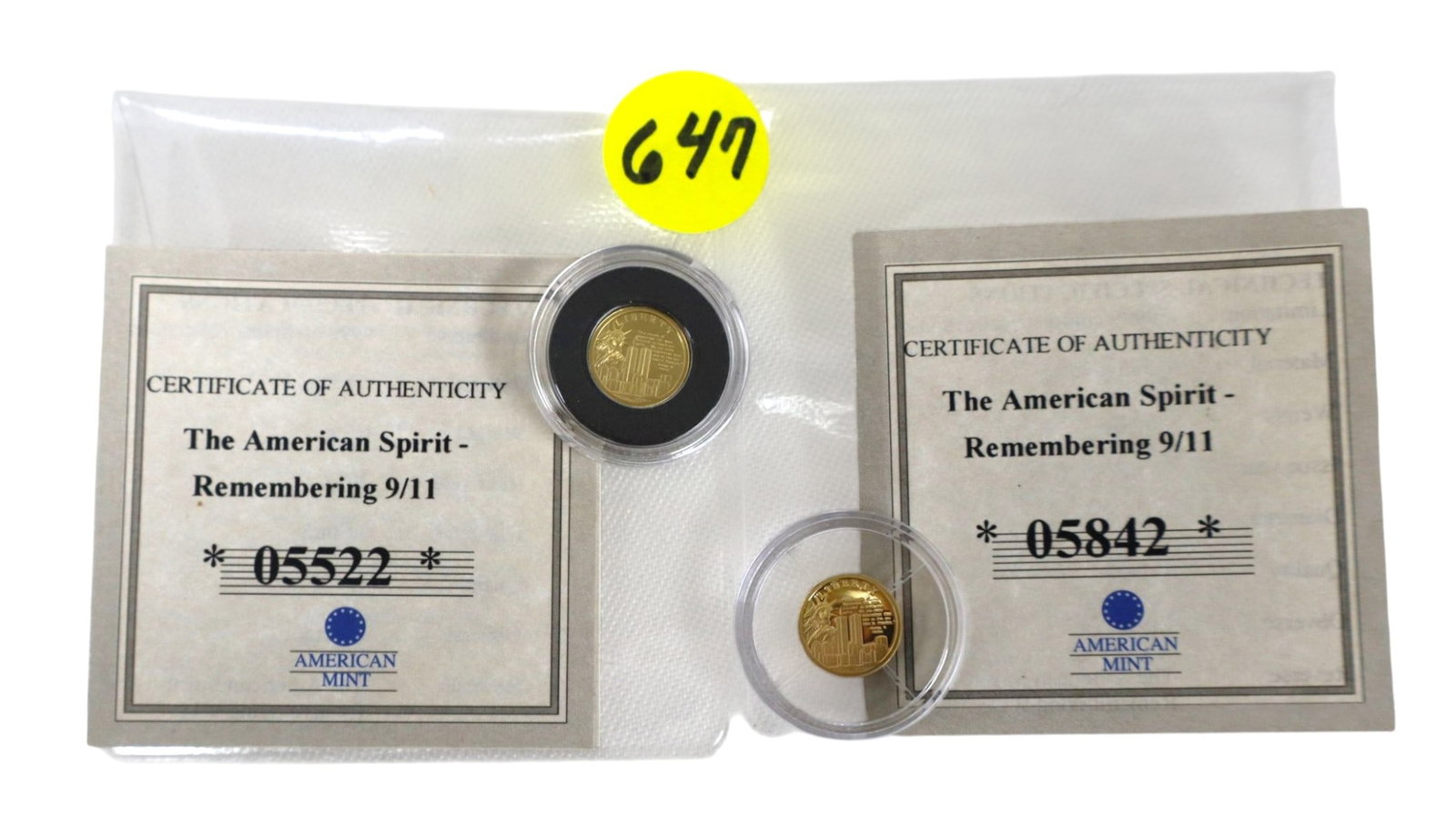 (2) 0.5g .585 Gold 9/11 Liberty & Twin Towers Coins COA: (2) American Spirit Remembering 911 gold coin complete with certificate of authenticity featuring liberty on the front and twin towers on back .5 grams