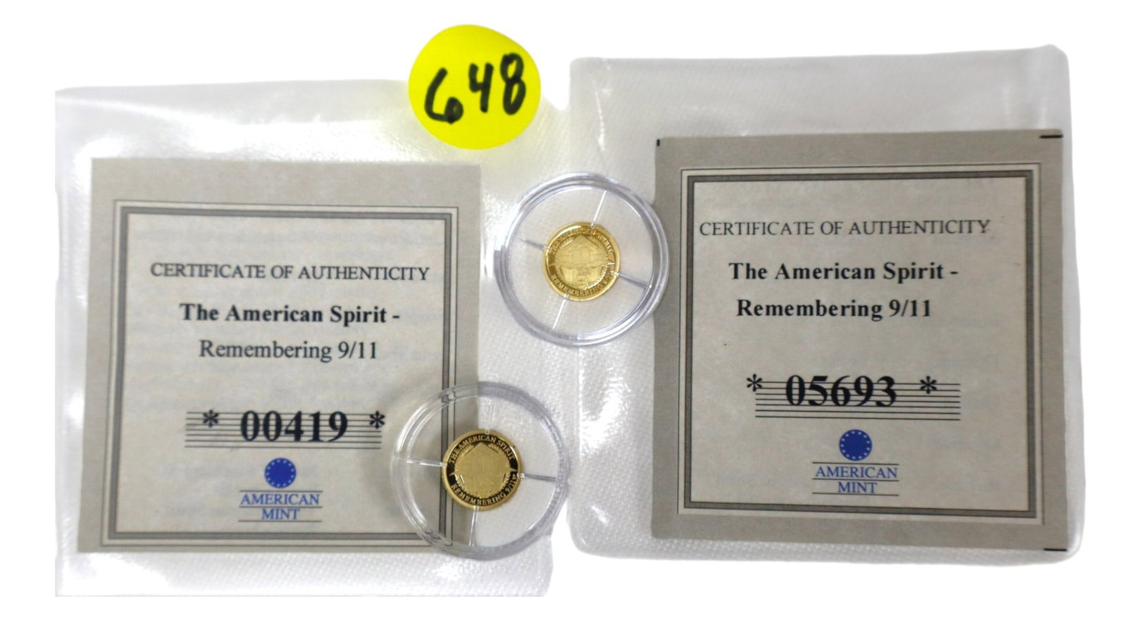 (2) 9/11 Twin Towers Remembering Gold Coins 0.5g COA: (2) American Spirit Remembering 911 gold coin complete with certificate of authenticity featuring Faith and Liberty on the front and twin towers on back .5 grams