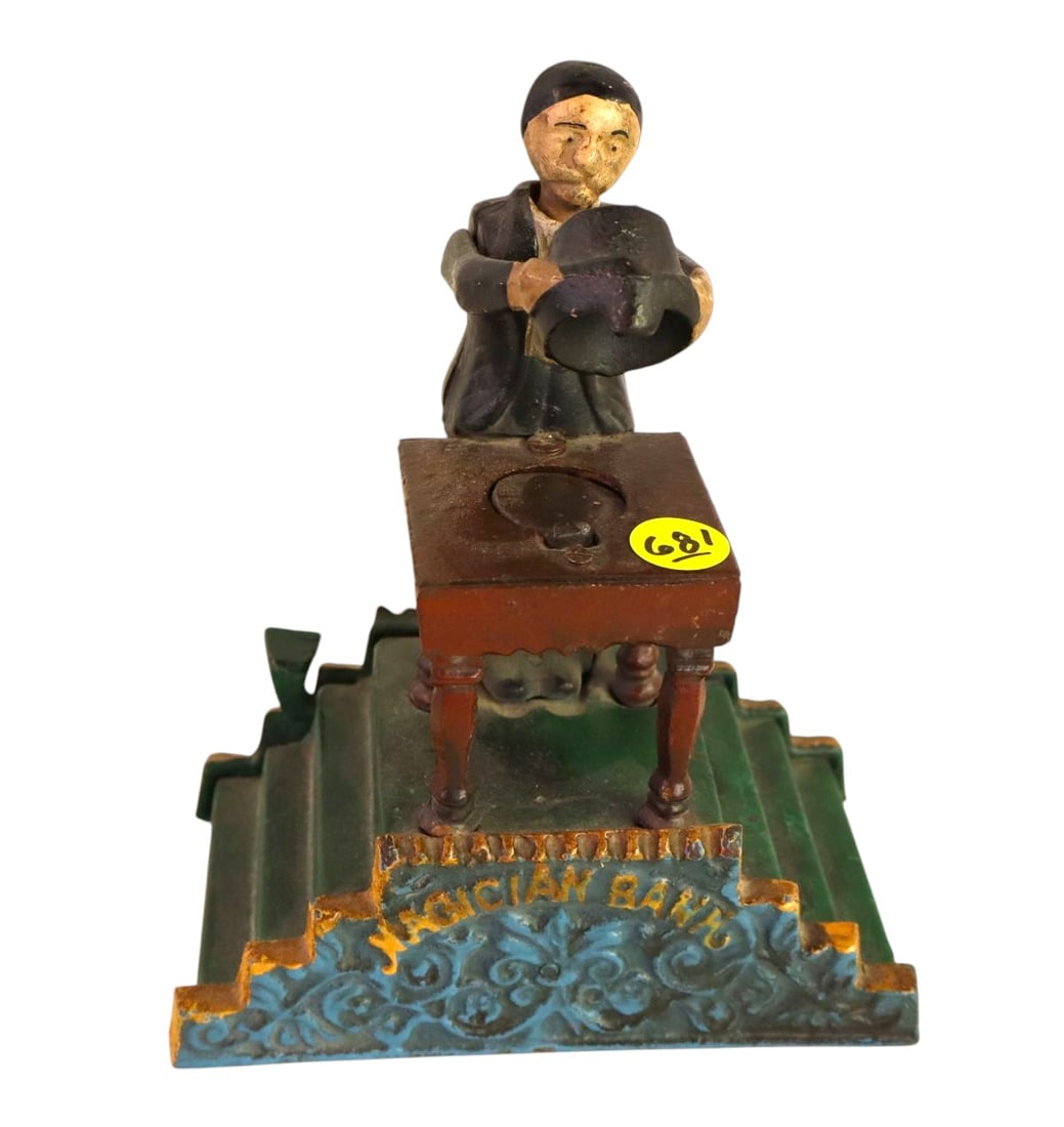 CI Magician mechanical bank in orig paint: Cast iron Magician mechanical bank in original paint, structurally sound. 7"h x 6"w x 4"d